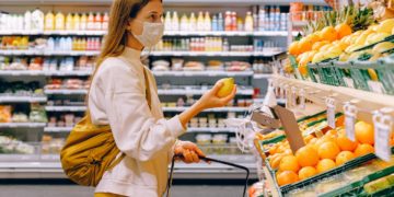 Photo by Anna Shvets from Pexels: https://www.pexels.com/photo/woman-in-yellow-tshirt-and-beige-jacket-holding-a-fruit-stand-3962285/