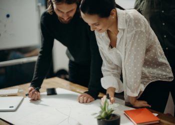 Photo by cottonbro studio: https://www.pexels.com/photo/man-and-woman-leaning-on-table-staring-at-white-board-on-top-of-table-having-a-meeting-3205570/