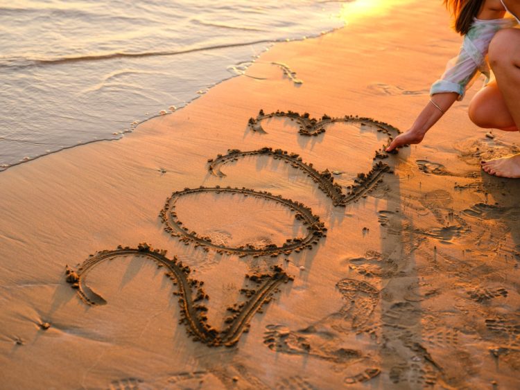 Photo by Engin Akyurt: https://www.pexels.com/photo/a-woman-writing-numbers-on-sand-with-her-hand-13088177/