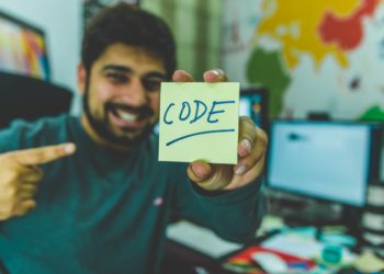Photo by hitesh choudhary: https://www.pexels.com/photo/man-in-grey-sweater-holding-yellow-sticky-note-879109/
