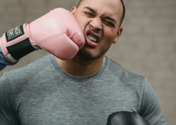 Photo by Julia Larson : https://www.pexels.com/photo/unrecognizable-boxer-hitting-young-ethnic-sportsman-during-training-6456268/