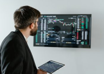 Photo by Tima Miroshnichenko: https://www.pexels.com/photo/man-in-black-suit-holding-a-digital-tablet-and-looking-at-data-on-screen-7567595/