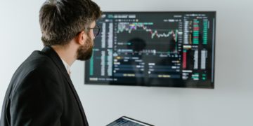 Photo by Tima Miroshnichenko: https://www.pexels.com/photo/man-in-black-suit-holding-a-digital-tablet-and-looking-at-data-on-screen-7567595/