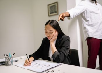 Photo by Yan Krukov: https://www.pexels.com/photo/a-woman-in-black-coat-sitting-at-the-table-7640418/