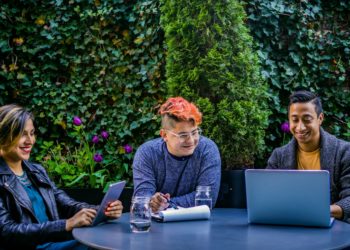 Photo by Jopwell: https://www.pexels.com/photo/two-men-and-woman-sitting-in-front-of-blue-table-2422282/