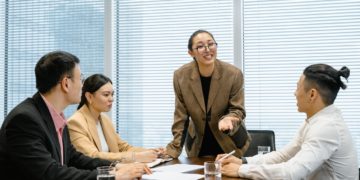 Photo by MART  PRODUCTION: https://www.pexels.com/photo/woman-wearing-eyeglasses-talking-at-the-meeting-7643872/