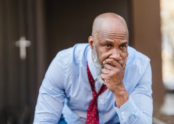 Photo by Nicola Barts : https://www.pexels.com/photo/concerned-black-businessman-in-city-7925815/