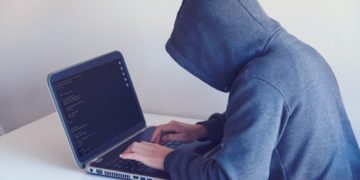 Photo by Nikita Belokhonov: https://www.pexels.com/photo/anonymous-hacker-with-on-laptop-in-white-room-5829726/