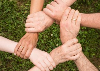 Photo by Pixabay: https://www.pexels.com/photo/group-of-people-holding-arms-461049/