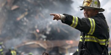 Photo by Pixabay: https://www.pexels.com/photo/fire-fighter-wearing-black-and-yellow-uniform-pointing-for-something-70573/
