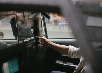 Photo by Tim  Samuel: https://www.pexels.com/photo/crop-male-passenger-inserting-card-in-credit-card-reader-in-taxi-5835268/