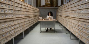 Photo by Tima Miroshnichenko: https://www.pexels.com/photo/a-girl-sitting-in-front-of-a-table-between-database-wooden-drawer-6549629/