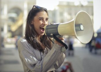 Photo by Andrea Piacquadio: https://www.pexels.com/photo/cheerful-young-woman-screaming-into-megaphone-3761509/