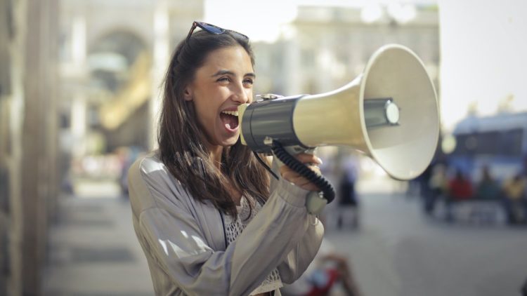 Photo by Andrea Piacquadio: https://www.pexels.com/photo/cheerful-young-woman-screaming-into-megaphone-3761509/