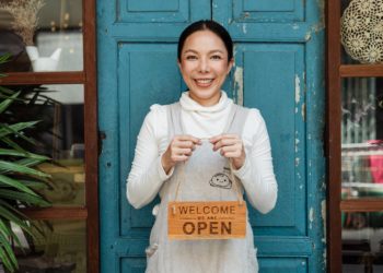 Photo by Ketut Subiyanto: https://www.pexels.com/photo/ethnic-female-cafe-owner-showing-welcome-we-are-open-inscription-4473398/