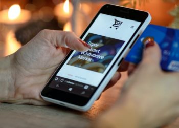 Photo by PhotoMIX Company: https://www.pexels.com/photo/person-using-black-and-white-smartphone-and-holding-blue-card-230544/