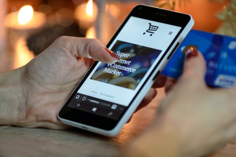Photo by PhotoMIX Company: https://www.pexels.com/photo/person-using-black-and-white-smartphone-and-holding-blue-card-230544/