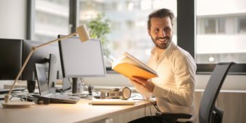 Photo by Andrea Piacquadio: https://www.pexels.com/photo/photo-of-man-holding-a-book-927022/