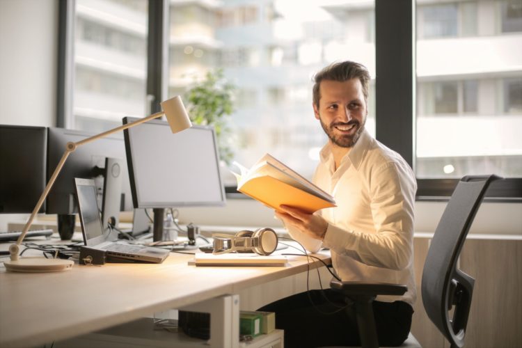 Photo by Andrea Piacquadio: https://www.pexels.com/photo/photo-of-man-holding-a-book-927022/