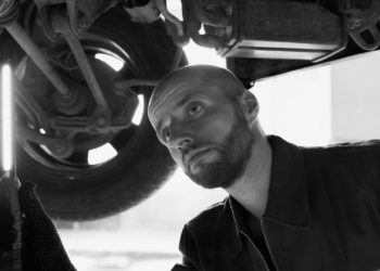 Photo by Artem Podrez: https://www.pexels.com/photo/black-and-white-photo-of-a-mechanic-under-a-car-8985605/