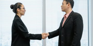 Photo by MART  PRODUCTION: https://www.pexels.com/photo/man-and-woman-shaking-hands-near-the-window-7643784/