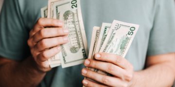 Photo by Karolina Grabowska: https://www.pexels.com/photo/crop-man-counting-dollar-banknotes-4386431/