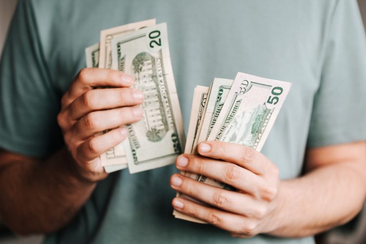 Photo by Karolina Grabowska: https://www.pexels.com/photo/crop-man-counting-dollar-banknotes-4386431/
