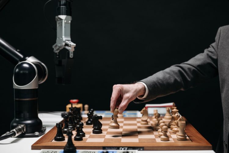 Photo by Pavel Danilyuk: https://www.pexels.com/photo/a-person-playing-chess-8438944/