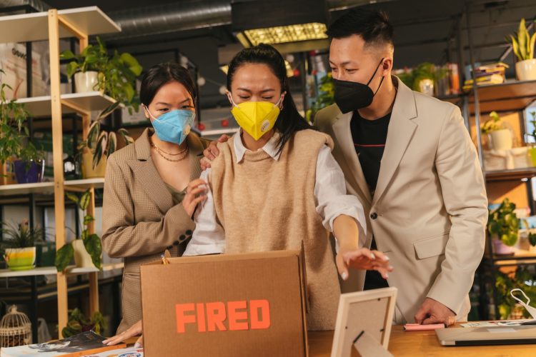 Photo by ANTONI SHKRABA production: https://www.pexels.com/photo/man-in-brown-coat-holding-brown-cardboard-box-8279209/