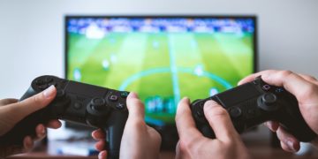 Photo by JESHOOTS.com from Pexels: https://www.pexels.com/photo/two-people-holding-black-gaming-consoles-442576/