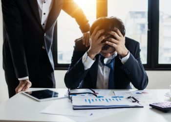 Photo by Khwanchai Phanthong: https://www.pexels.com/photo/man-in-black-suit-jacket-feeling-stressed-4175021/