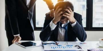 Photo by Khwanchai Phanthong: https://www.pexels.com/photo/man-in-black-suit-jacket-feeling-stressed-4175021/