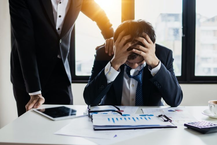 Photo by Khwanchai Phanthong: https://www.pexels.com/photo/man-in-black-suit-jacket-feeling-stressed-4175021/