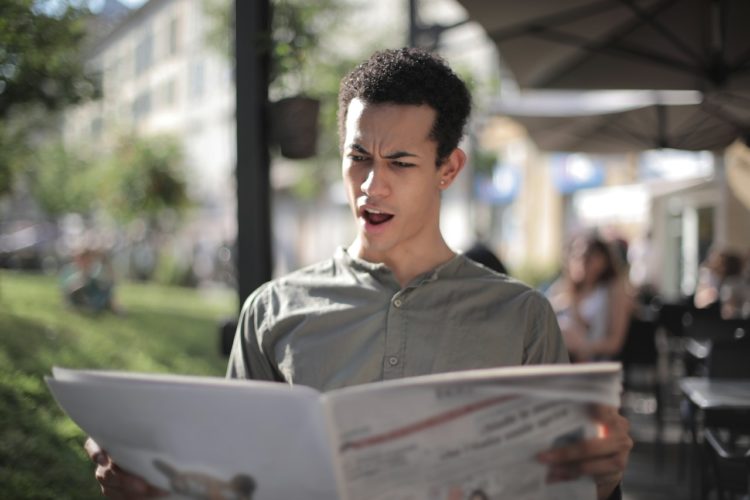 Photo by Andrea Piacquadio: https://www.pexels.com/photo/shallow-focus-photo-of-man-reading-newspaper-3799099/