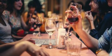 Photo by Helena Lopes: https://www.pexels.com/photo/people-drinking-liquor-and-talking-on-dining-table-close-up-photo-696218/
