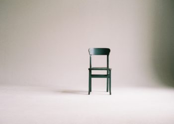 Photo by Paula Schmidt: https://www.pexels.com/photo/wooden-chair-on-a-white-wall-studio-963486/
