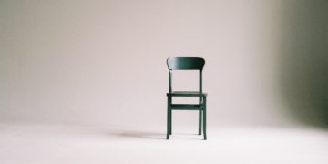 Photo by Paula Schmidt: https://www.pexels.com/photo/wooden-chair-on-a-white-wall-studio-963486/
