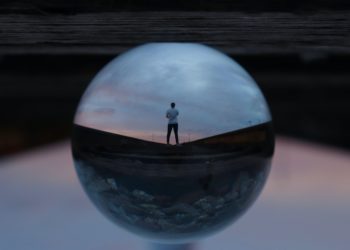 Photo by Jeremy Perkins: https://www.pexels.com/photo/round-glass-ball-reflecting-man-standing-395612/