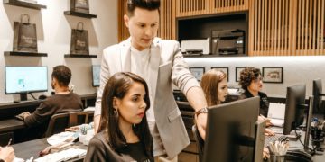 Photo by Jonathan Borba: https://www.pexels.com/photo/man-teaching-woman-in-front-of-monitor-3285203/