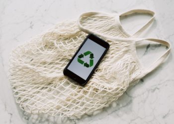 Photo by ready made: https://www.pexels.com/photo/mobile-phone-with-green-recycling-sign-and-mesh-bag-3850512/