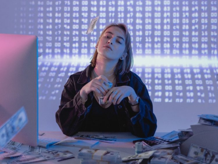 Photo by Tima Miroshnichenko: https://www.pexels.com/photo/a-confident-woman-holding-bundles-of-cash-money-6266641/