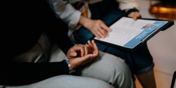 Photo by cottonbro studio: https://www.pexels.com/photo/person-in-white-long-sleeve-shirt-holding-a-clipboard-with-resume-5989933/
