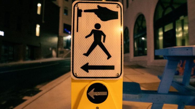 Photo by Erik Mclean: https://www.pexels.com/photo/sign-for-pedestrians-on-post-on-roadside-5864188/