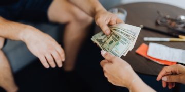 Photo by Karolina Grabowska: https://www.pexels.com/photo/person-giving-money-to-another-person-4968548/