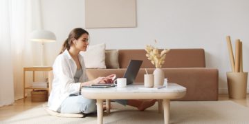 Photo by Artem Podrez: https://www.pexels.com/photo/content-woman-using-laptop-on-floor-4492129/