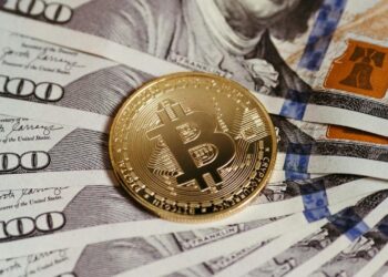 Photo by Jonathan Borba: https://www.pexels.com/photo/cryptocurrency-and-dollar-banknotes-14832162/