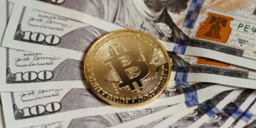 Photo by Jonathan Borba: https://www.pexels.com/photo/cryptocurrency-and-dollar-banknotes-14832162/
