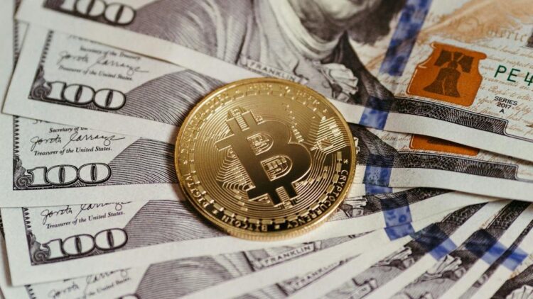 Photo by Jonathan Borba: https://www.pexels.com/photo/cryptocurrency-and-dollar-banknotes-14832162/