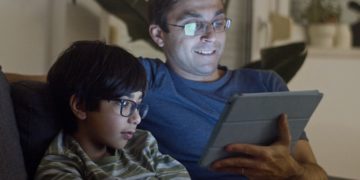 Photo by Kampus Production: https://www.pexels.com/photo/father-and-son-watching-video-7414064/