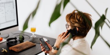 Photo by Karolina Grabowska: https://www.pexels.com/photo/busy-female-talking-on-smartphone-and-checking-messages-during-work-in-contemporary-office-4476635/